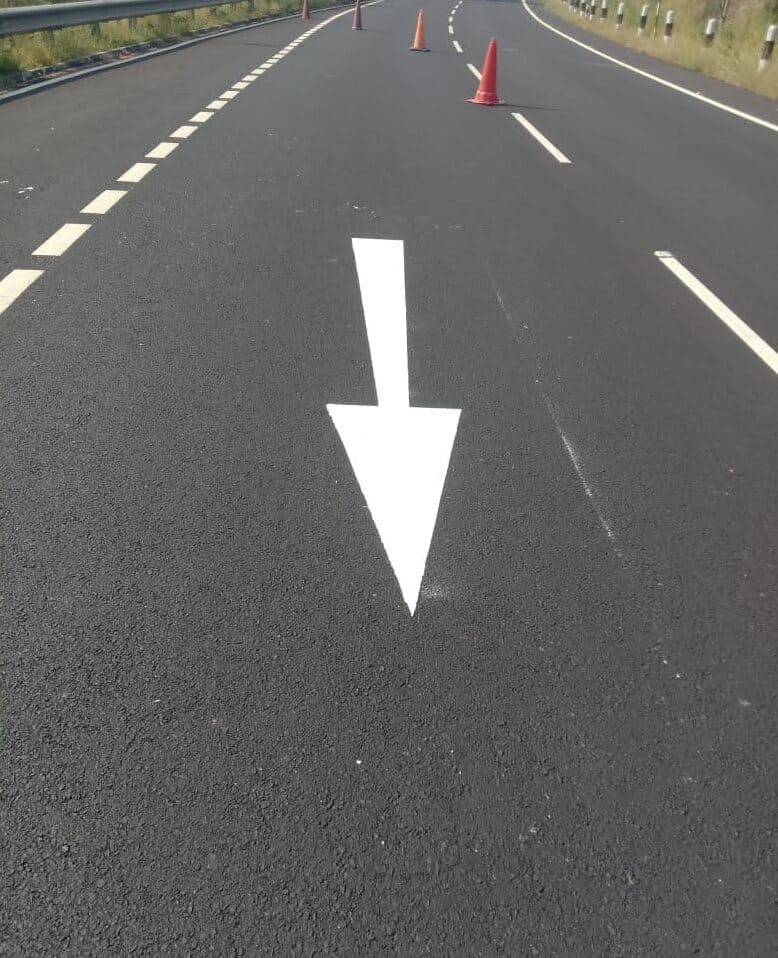 Infrastructure project site with road construction machinery